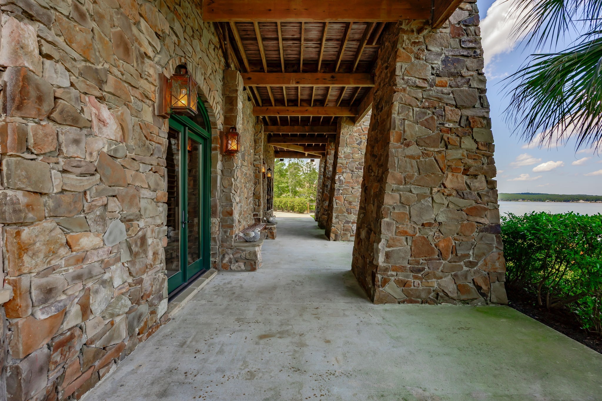 Rock Bridge Lodge exterior at dusk — stone and timber architecture