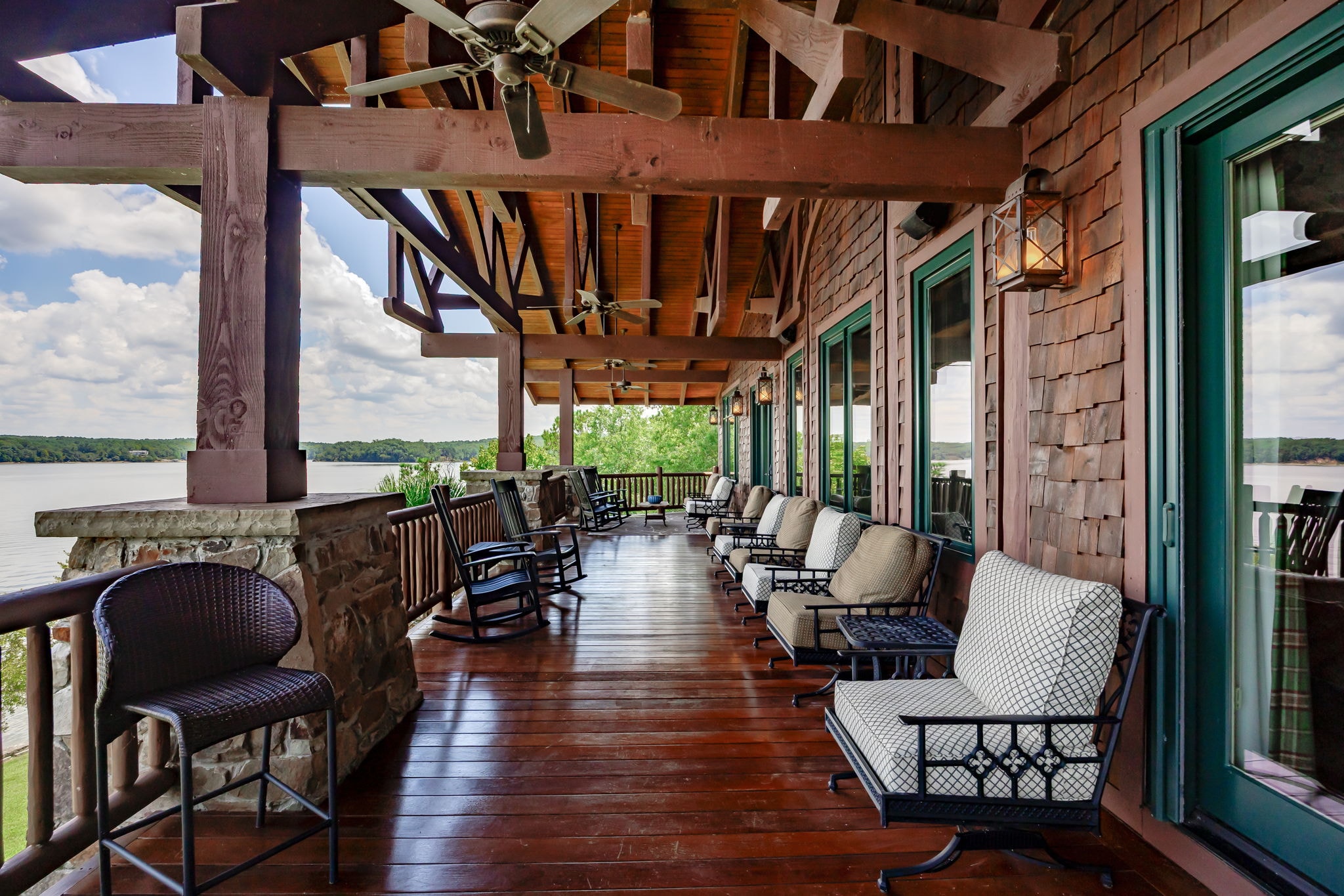 Rock Bridge Lodge interior — timber beams and stone fireplace